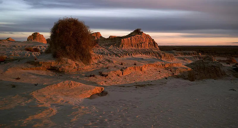 Rock formation in sandy desert