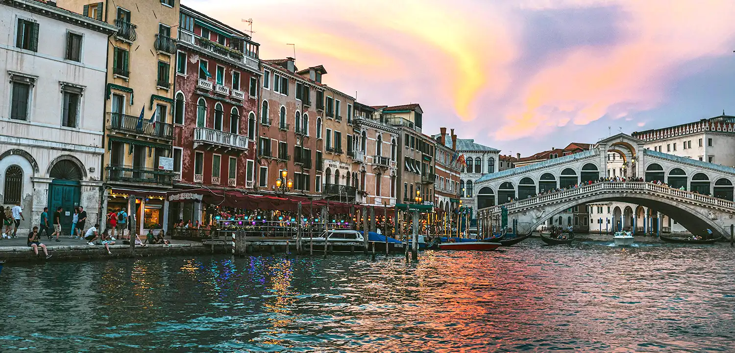 Bridge over water at sunset